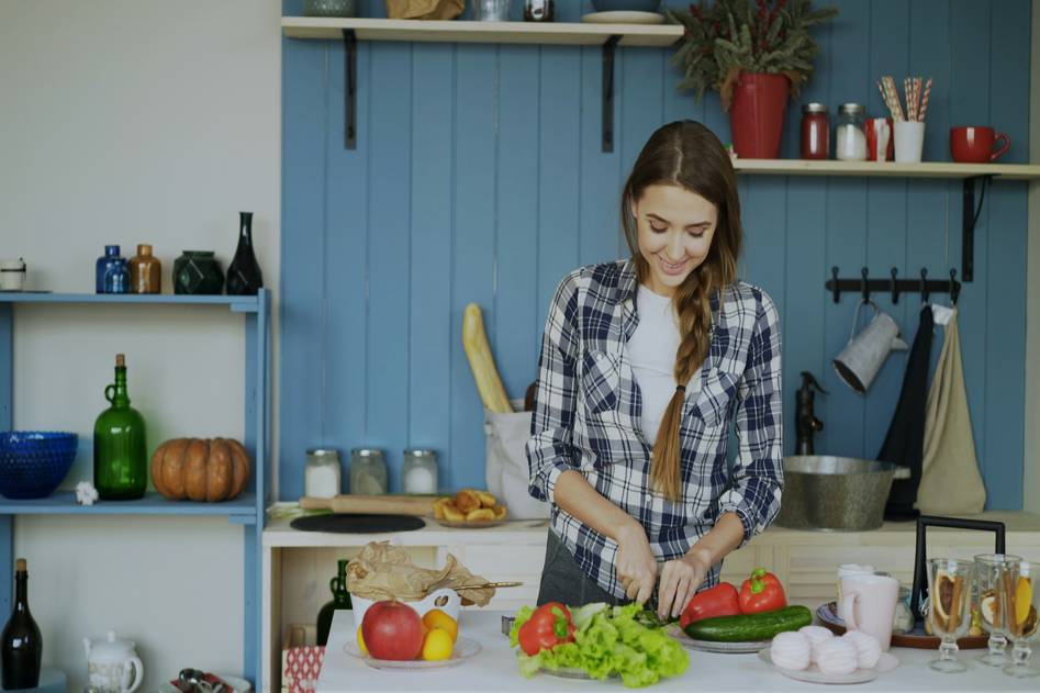 Parent preparing colorful quick meal with kids at kitchen counter